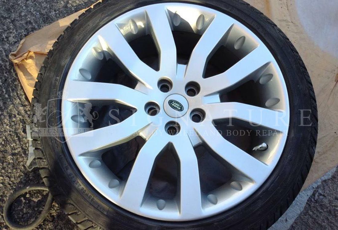 Silver Land Rover alloy wheel refurbished with the tyre still fitted