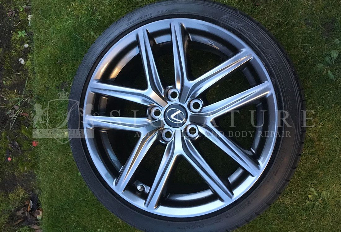 Dark grey Mercedes alloy wheel photographed after a full refurbishment