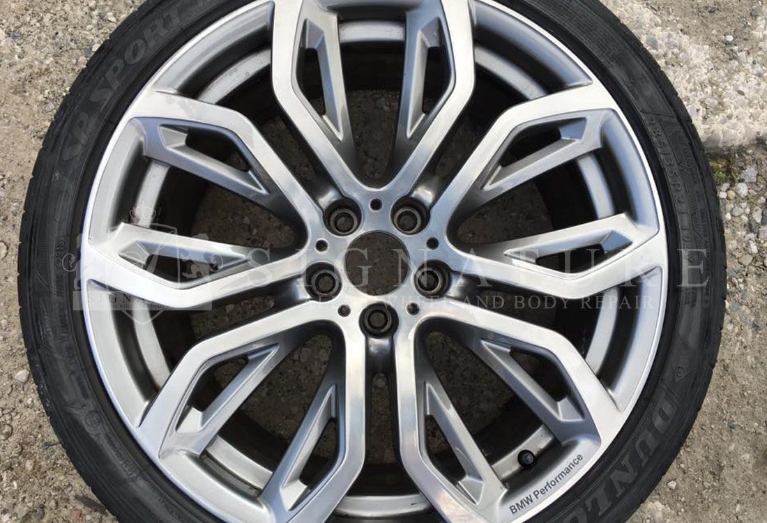 Grey BMW X series alloy wheel after a kerb damage repair