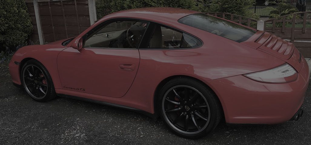 Red sports car with paintwork corrected by machine polishing