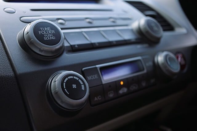 Car dashboard showing the centre air vents and stereo controls