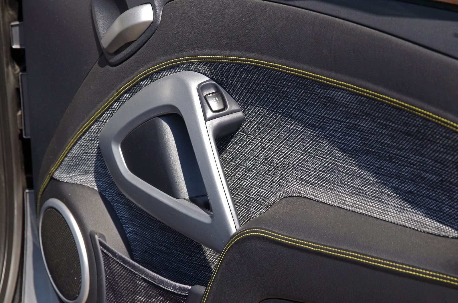 The interior of a car showing the seat, plastic trim and centre console