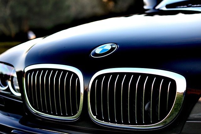 The front of a modern car photographed at an angle on a road