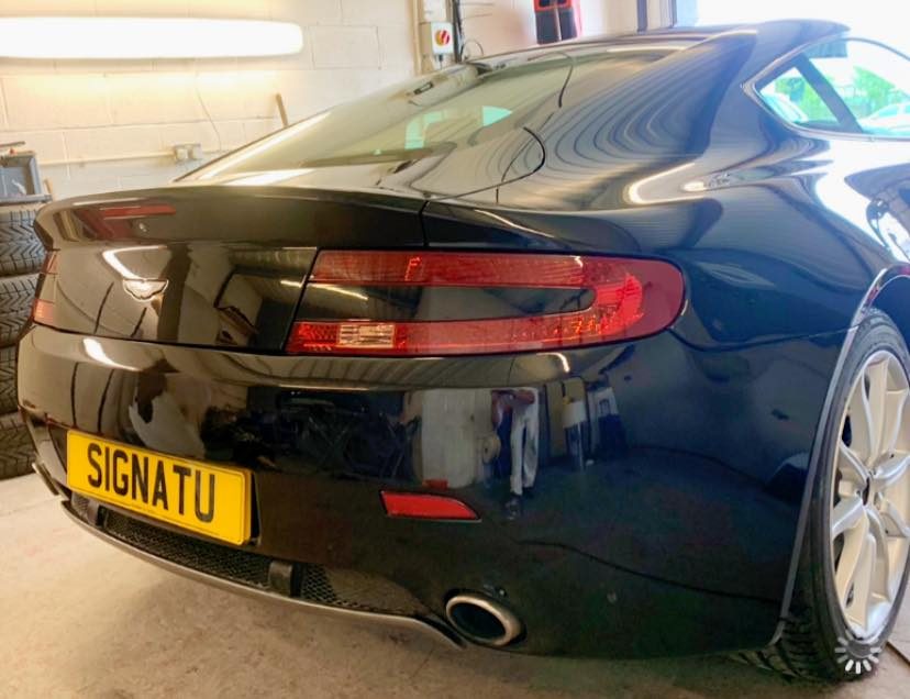 Mobile bumper scuff repair being carried out on a car