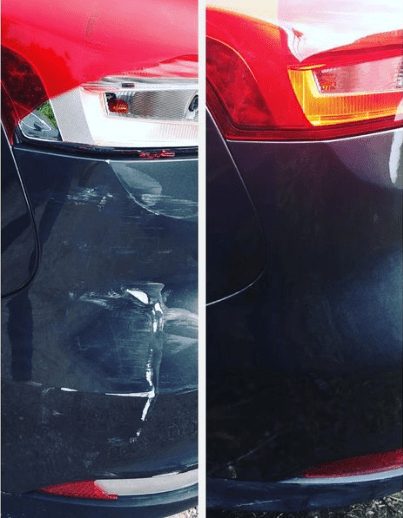 Rear bumper of a dark coloured car after repair, showing an even painted finish