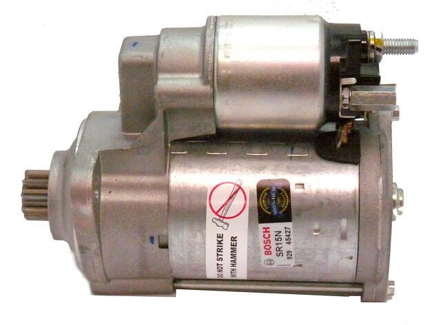 A Bosch starter motor removed from a car engine, photographed on a plain background