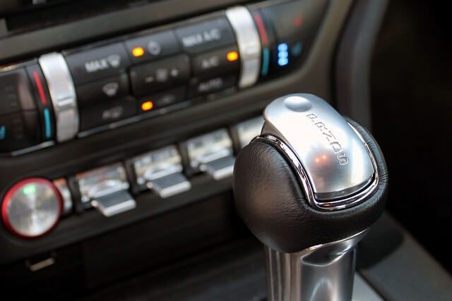 A modern car gearbox and transmission assembly viewed from the side